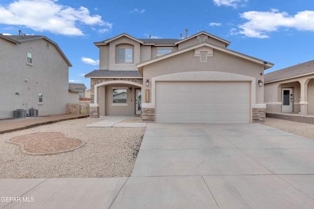 14953 Willie Worsley Ave, El Paso, TX 79938 - view of front of home with stone siding, stucco siding, central AC unit, and concrete driveway