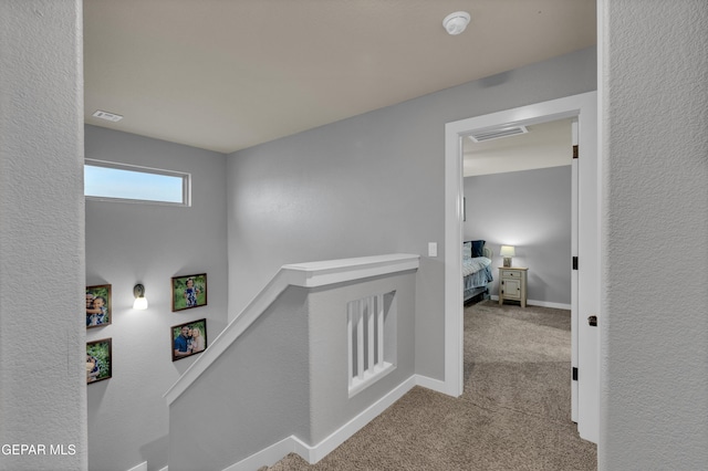 14953 Willie Worsley Ave, El Paso, TX 79938 - corridor with carpet flooring, an upstairs landing, and baseboards