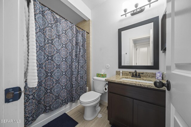14677 Christian Castle, El Paso, TX 79938 - full bath featuring toilet, vanity, and shower / bath combo with shower curtain