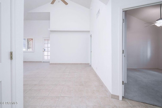 4560 Loma Canada Ct, El Paso, TX 79934 - corridor featuring high vaulted ceiling, light tile patterned flooring, and baseboards