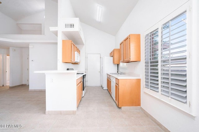4560 Loma Canada Ct, El Paso, TX 79934 - kitchen featuring white appliances, high vaulted ceiling, light countertops, a sink, and light tile patterned flooring