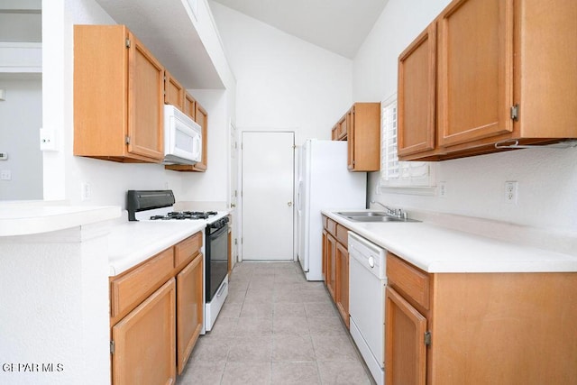 4560 Loma Canada Ct, El Paso, TX 79934 - kitchen featuring white appliances, a sink, light countertops, light tile patterned floors, and vaulted ceiling