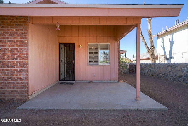 4560 Loma Canada Ct, El Paso, TX 79934 - property entrance with a patio and brick siding