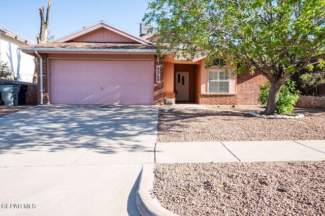 4560 Loma Canada Ct, El Paso, TX 79934 - view of front of house with brick siding, driveway, and a garage
