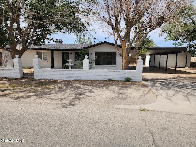 301 Bandolina Dr, Socorro, TX 79927 - ranch-style home with a carport, brick siding, and driveway
