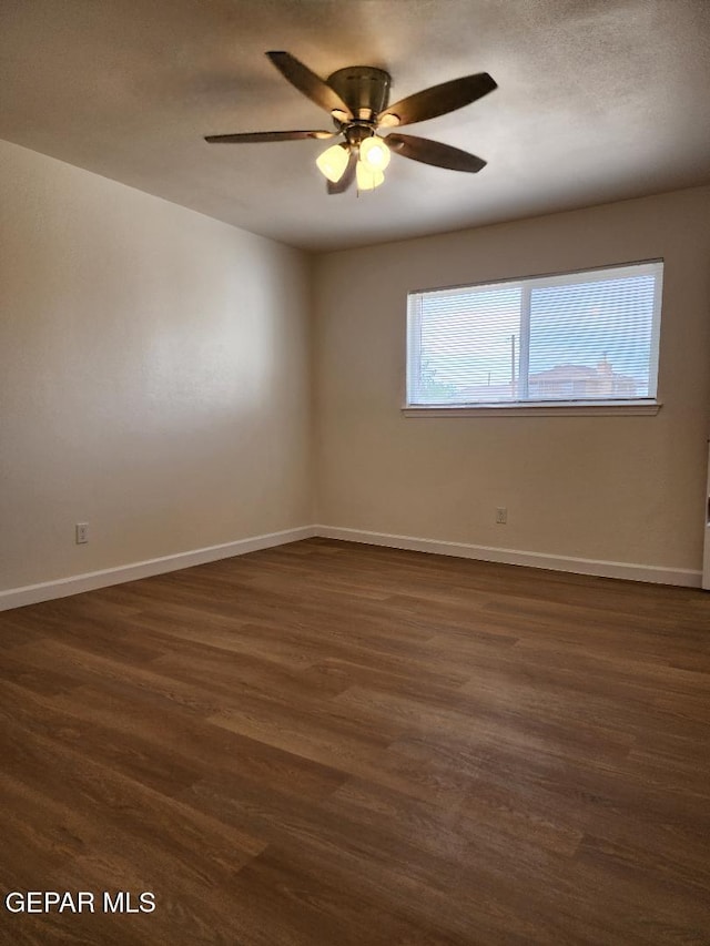 301 Bandolina Dr, Socorro, TX 79927 - spare room with dark wood-style floors, baseboards, and ceiling fan