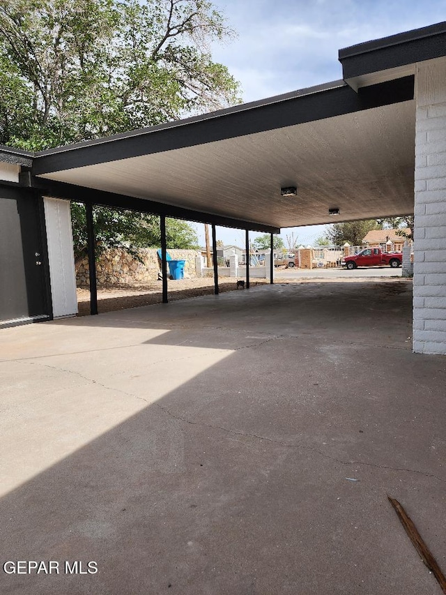 301 Bandolina Dr, Socorro, TX 79927 - view of parking / parking lot featuring asphalt driveway and a carport