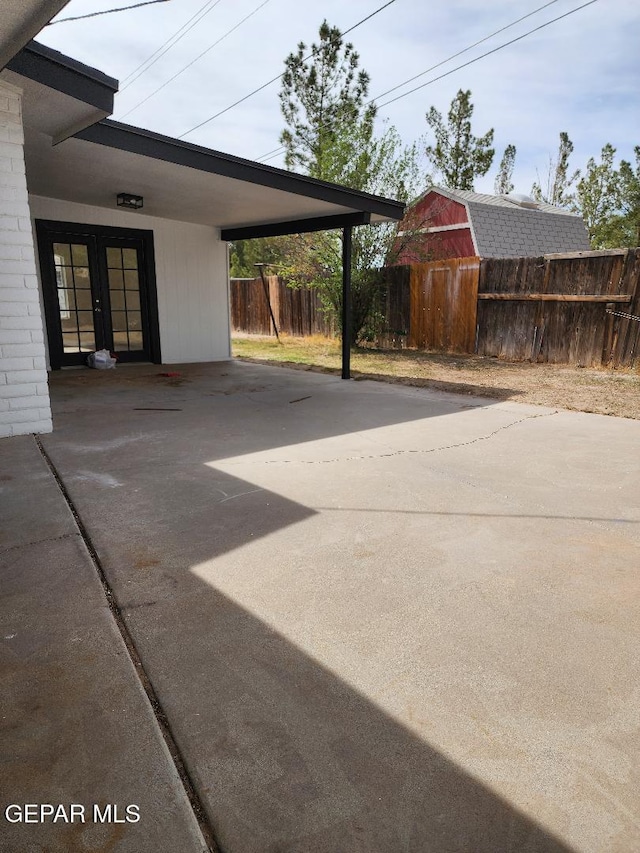 301 Bandolina Dr, Socorro, TX 79927 - view of patio / terrace with an attached carport, driveway, and french doors