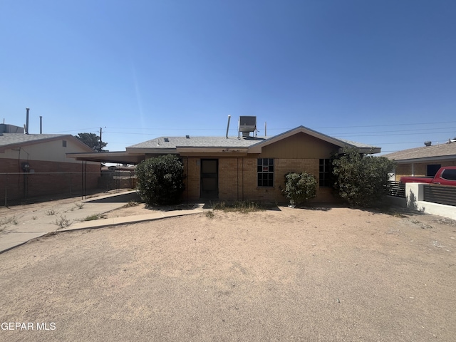 9354 Elgin Dr, El Paso, TX 79907 - ranch-style house featuring fence, concrete driveway, an attached carport, and brick siding