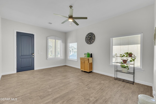 14733 Mike A Mendoza Ave, El Paso, TX 79938 - entryway with a ceiling fan, light wood finished floors, and baseboards