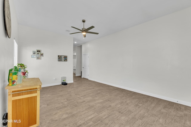 14733 Mike A Mendoza Ave, El Paso, TX 79938 - empty room with ceiling fan, light wood-style flooring, and baseboards