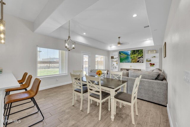 14733 Mike A Mendoza Ave, El Paso, TX 79938 - dining area featuring baseboards, light wood finished floors, a tray ceiling, built in features, and recessed lighting