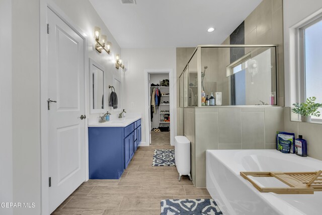 14733 Mike A Mendoza Ave, El Paso, TX 79938 - full bath featuring a stall shower, vanity, plenty of natural light, a bath, and recessed lighting