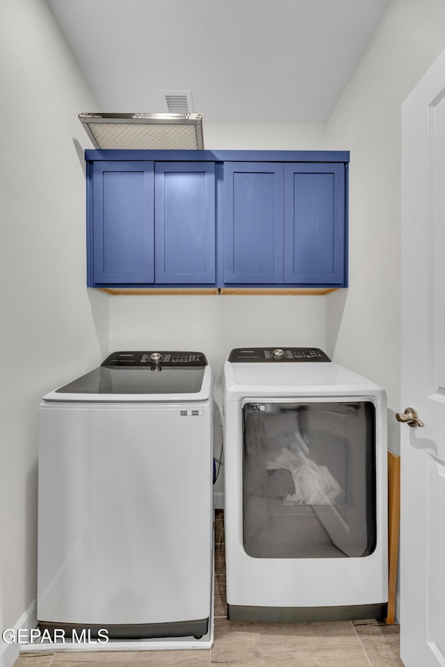 14733 Mike A Mendoza Ave, El Paso, TX 79938 - laundry room with washing machine and clothes dryer, cabinet space, and baseboards
