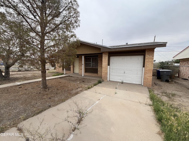 952 Zacatecas Ct, El Paso, TX 79907 - view of front of home with a garage, driveway, and brick siding