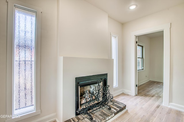 2300 N Campbell St, El Paso, TX 79902 - detailed view of wood finished floors, a fireplace with raised hearth, and recessed lighting