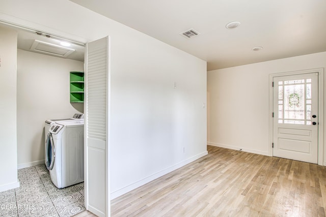 2300 N Campbell St, El Paso, TX 79902 - laundry area featuring independent washer and dryer, attic access, and light wood-type flooring