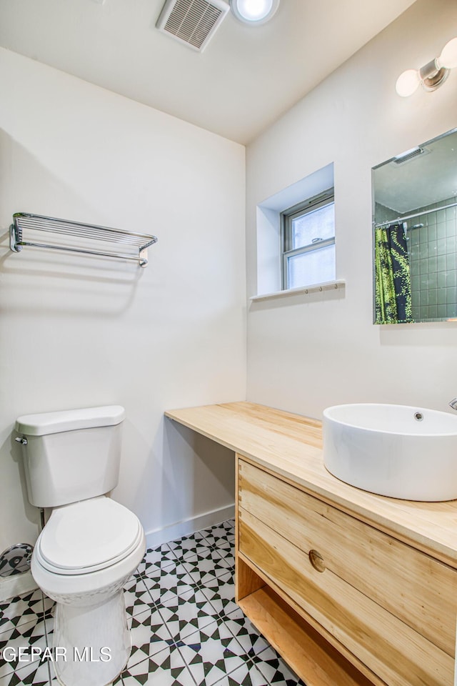 2300 N Campbell St, El Paso, TX 79902 - bathroom with tile patterned floors, vanity, and a shower with shower curtain
