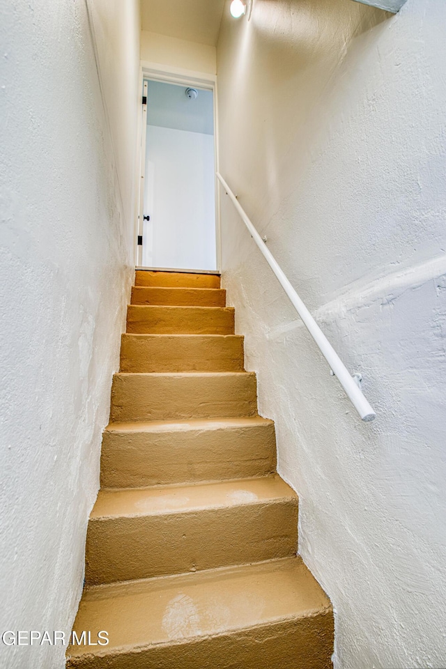 2300 N Campbell St, El Paso, TX 79902 - staircase featuring a textured wall