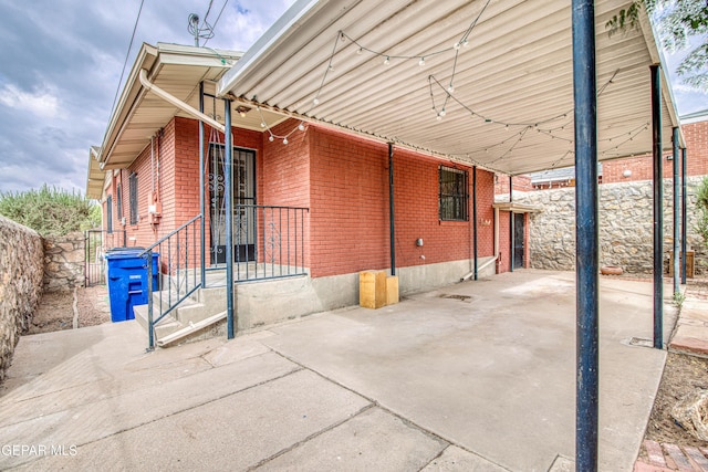 2300 N Campbell St, El Paso, TX 79902 - view of side of home with brick siding and a carport