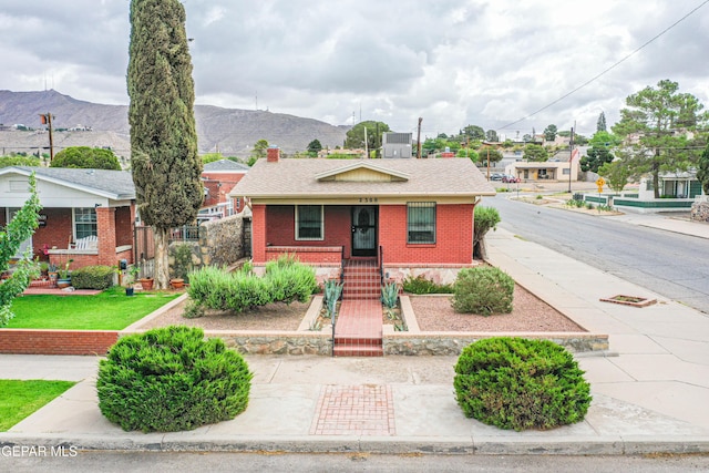 2300 N Campbell St, El Paso, TX 79902 - view of front of property featuring brick siding, a mountain view, a chimney, and roof with shingles