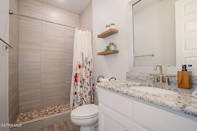 7389 Cimarron Gap Dr, El Paso, TX 79911 - bathroom with vanity, toilet, and tiled shower