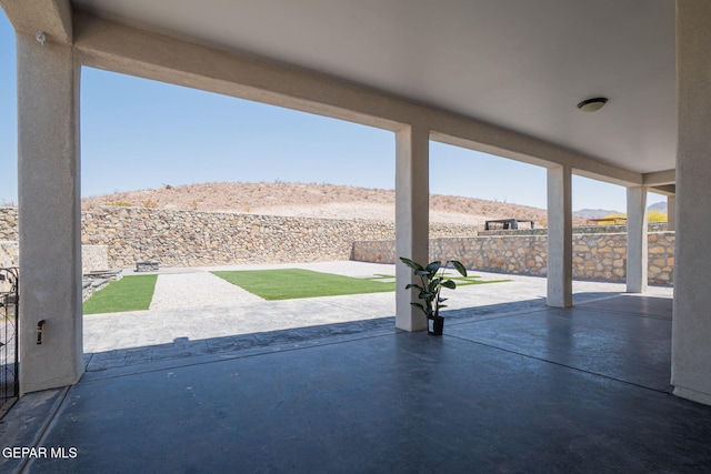 7389 Cimarron Gap Dr, El Paso, TX 79911 - fenced backyard with a mountain view and a patio area
