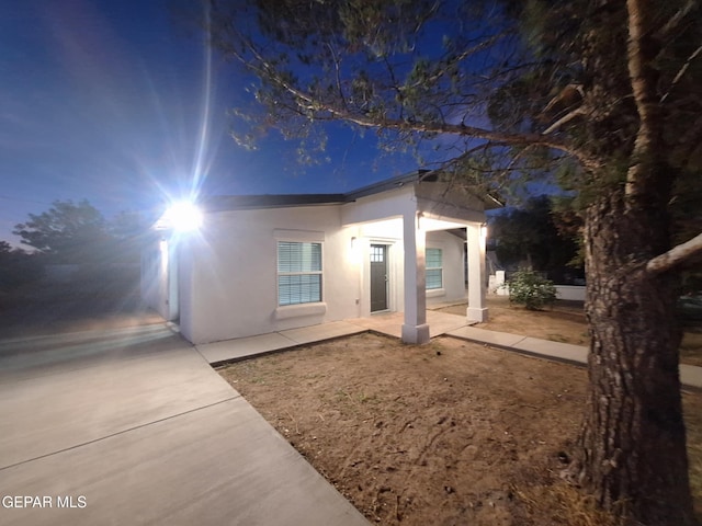 11574 La Poblana Dr, Socorro, TX 79927 - view of front of house featuring stucco siding and a patio area