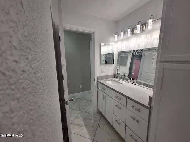 11574 La Poblana Dr, Socorro, TX 79927 - bathroom featuring marble finish floors and vanity