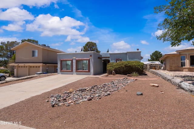 903 Agua Caliente Dr, El Paso, TX 79912 - view of front facade with a garage and driveway