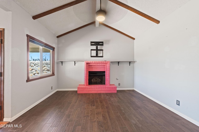 903 Agua Caliente Dr, El Paso, TX 79912 - unfurnished living room with dark wood finished floors, a brick fireplace, a ceiling fan, baseboards, and a textured ceiling