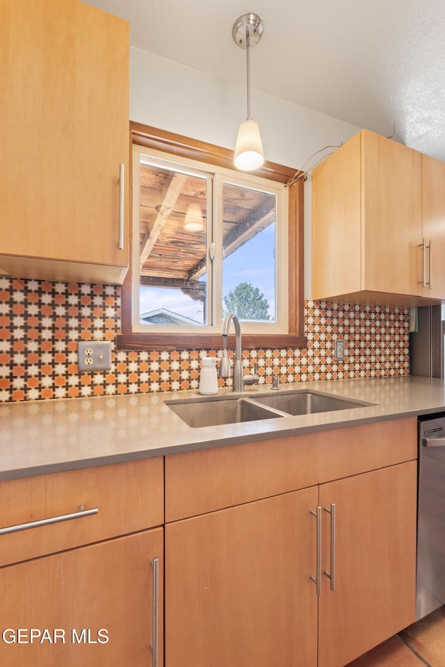 903 Agua Caliente Dr, El Paso, TX 79912 - kitchen featuring a sink, light brown cabinets, dishwasher, and light countertops