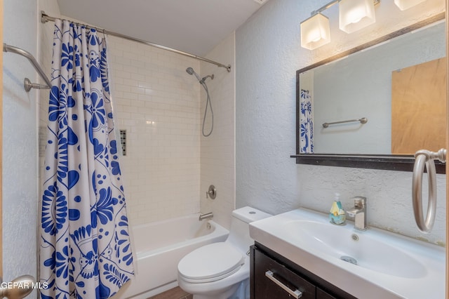 903 Agua Caliente Dr, El Paso, TX 79912 - full bath with a textured wall, vanity, shower / tub combo, and toilet
