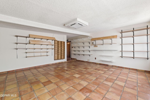 903 Agua Caliente Dr, El Paso, TX 79912 - garage featuring baseboards