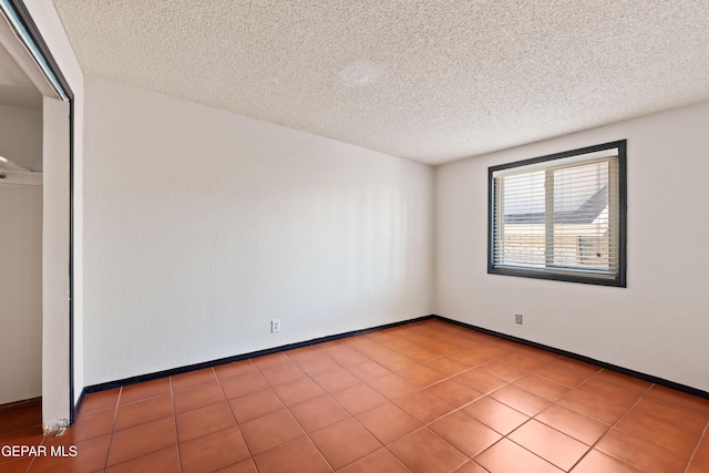 903 Agua Caliente Dr, El Paso, TX 79912 - spare room with a textured ceiling and baseboards