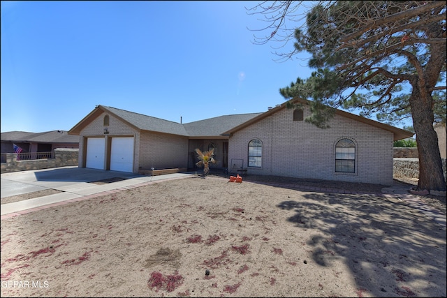 4372 Loma De Oro Dr, El Paso, TX 79934 - single story home featuring brick siding, a garage, and concrete driveway