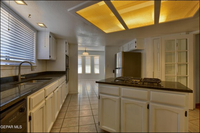 4372 Loma De Oro Dr, El Paso, TX 79934 - kitchen with a sink, freestanding refrigerator, dishwasher, cooktop, and light tile patterned floors