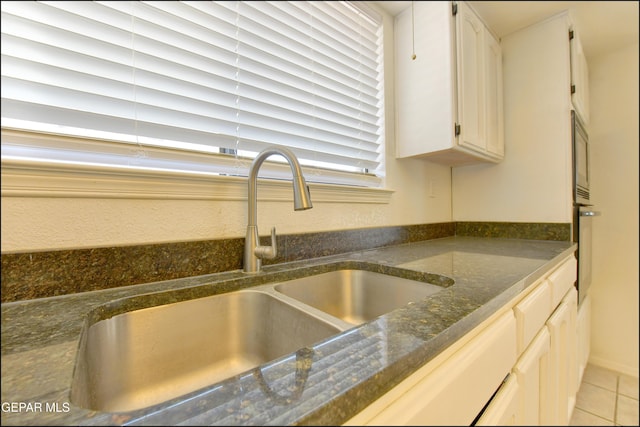 4372 Loma De Oro Dr, El Paso, TX 79934 - kitchen featuring a sink, dark stone countertops, wall oven, white cabinetry, and light tile patterned floors