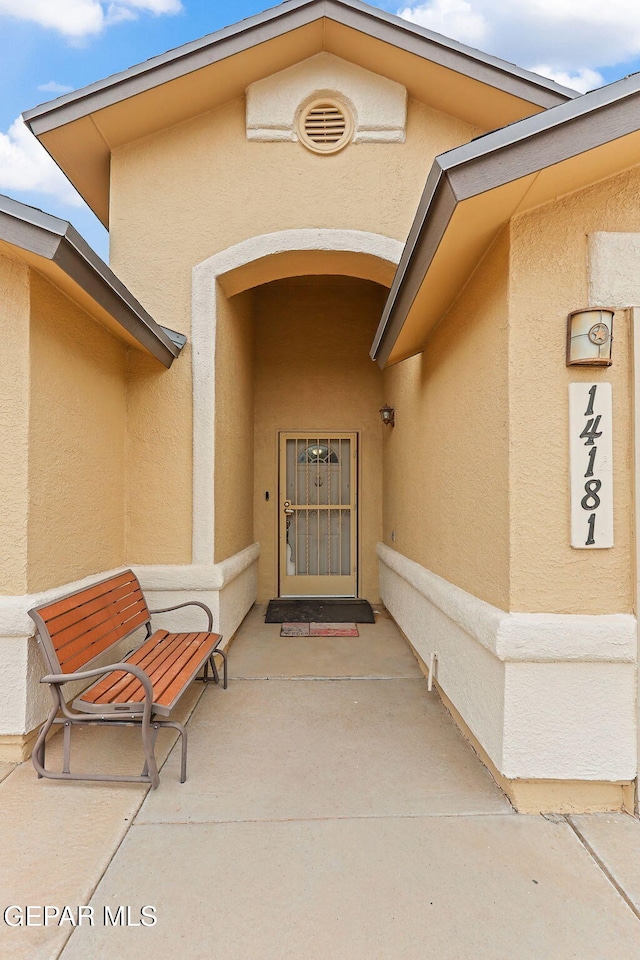 14181 Rudy Valdez Dr, El Paso, TX 79938 - view of exterior entry with stucco siding