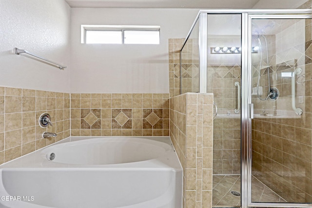 14181 Rudy Valdez Dr, El Paso, TX 79938 - bathroom featuring a garden tub and a shower stall