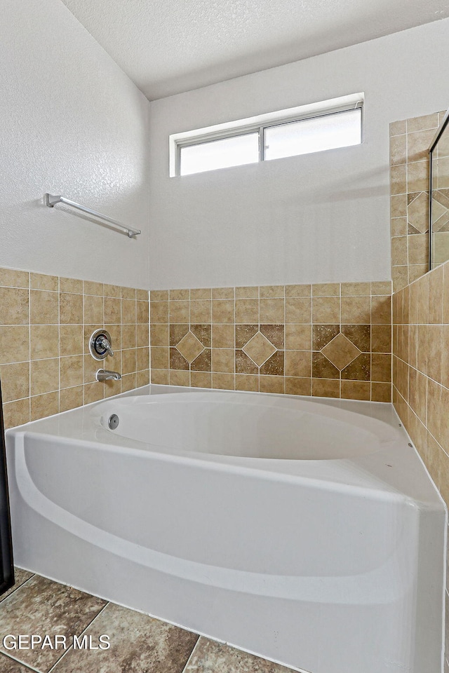 14181 Rudy Valdez Dr, El Paso, TX 79938 - full bathroom with a garden tub