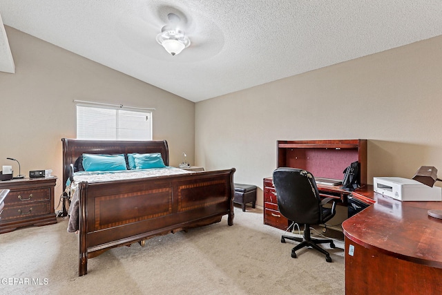 14181 Rudy Valdez Dr, El Paso, TX 79938 - carpeted bedroom with lofted ceiling, a desk, and a textured ceiling