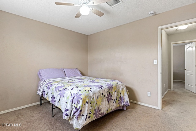 14181 Rudy Valdez Dr, El Paso, TX 79938 - bedroom featuring carpet, a textured ceiling, baseboards, and a ceiling fan