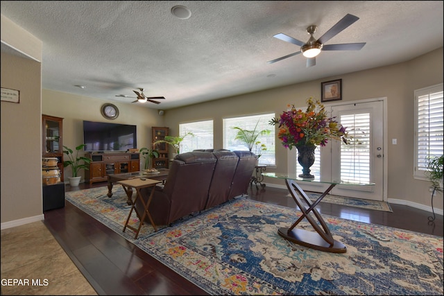 1337 Emerald Gate Ln, El Paso, TX 79936 - living area with a ceiling fan, a textured ceiling, and baseboards