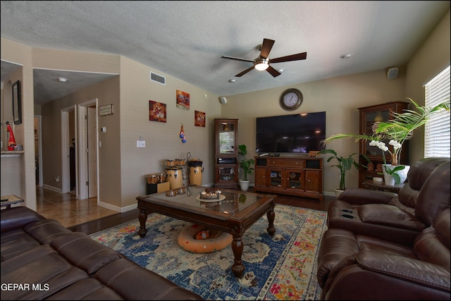 1337 Emerald Gate Ln, El Paso, TX 79936 - living room featuring a ceiling fan, a textured ceiling, and baseboards