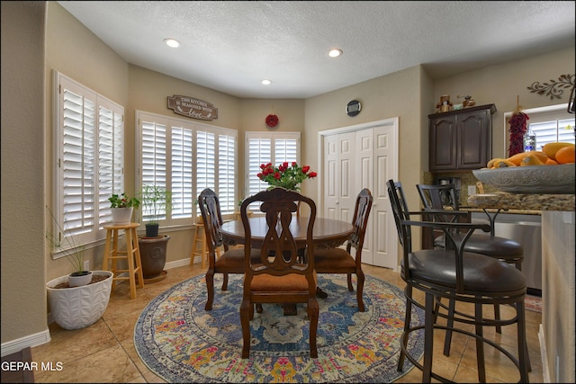 1337 Emerald Gate Ln, El Paso, TX 79936 - dining room featuring recessed lighting, a textured ceiling, and baseboards