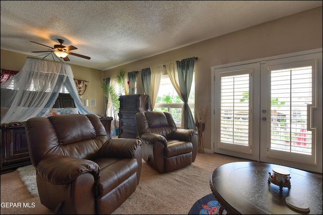 1337 Emerald Gate Ln, El Paso, TX 79936 - living room with carpet flooring, french doors, a textured ceiling, and a ceiling fan