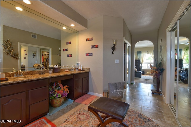 1337 Emerald Gate Ln, El Paso, TX 79936 - full bath with double vanity, baseboards, and recessed lighting