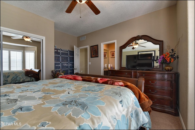 1337 Emerald Gate Ln, El Paso, TX 79936 - carpeted bedroom with a textured ceiling and a ceiling fan