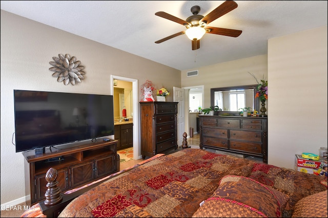 1337 Emerald Gate Ln, El Paso, TX 79936 - bedroom with ensuite bathroom, baseboards, and a ceiling fan